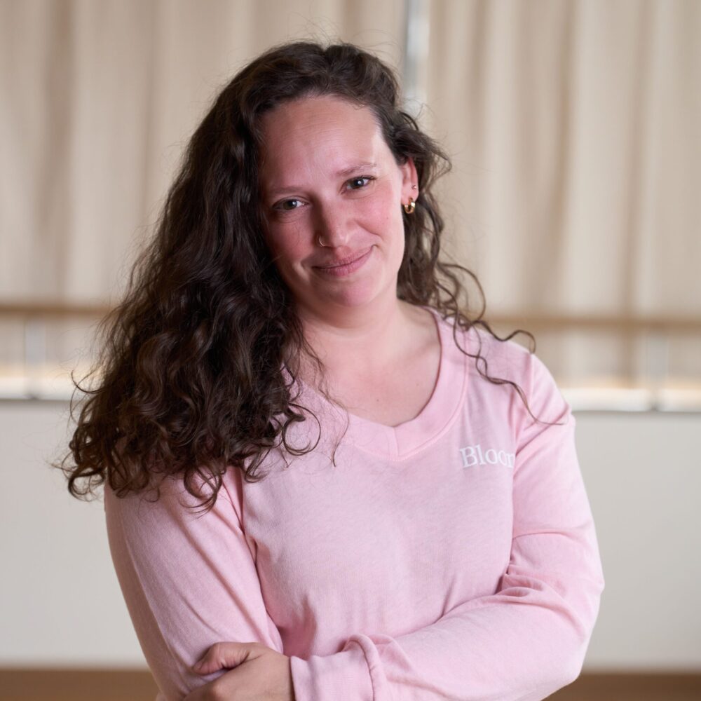 Kristina Luby smiling in a yoga studio